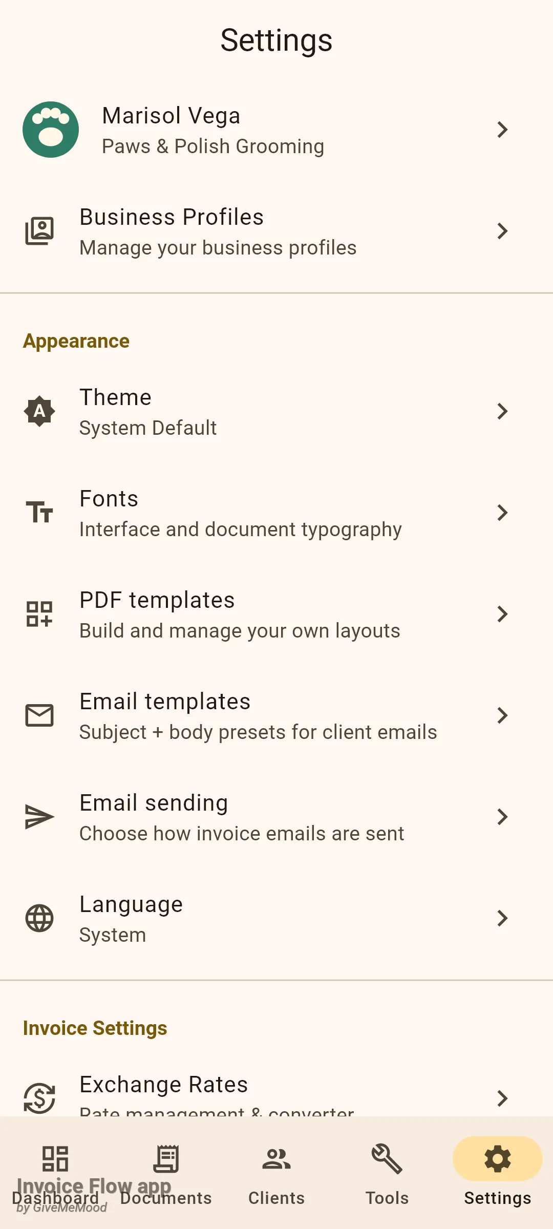 Invoice Flow app Settings screen showing the profile tile Marisol Vega, Paws & Polish Grooming with a paw logo, the Business Profiles row, and the Appearance group with Theme set to System Default, Fonts, PDF templates, Email templates, Email sending and Language set to System